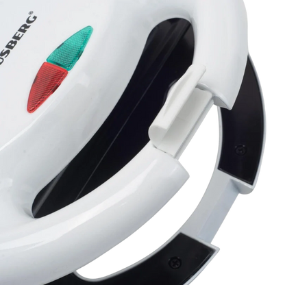 Close-up of a white iron with black handles and a red and green label on a white background.