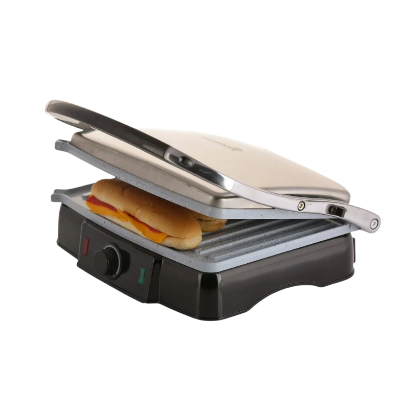 Panini press with a sandwich inside on a white background