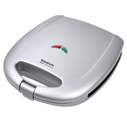 Silver sandwich toaster with Taurus branding on a white background